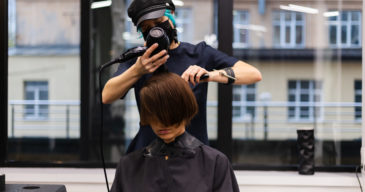 professional-girl-hairdresser-makes-client-haircut-the-girl-is-sitting-in-mask-in-beauty-the-salon-1-scaled.jpg